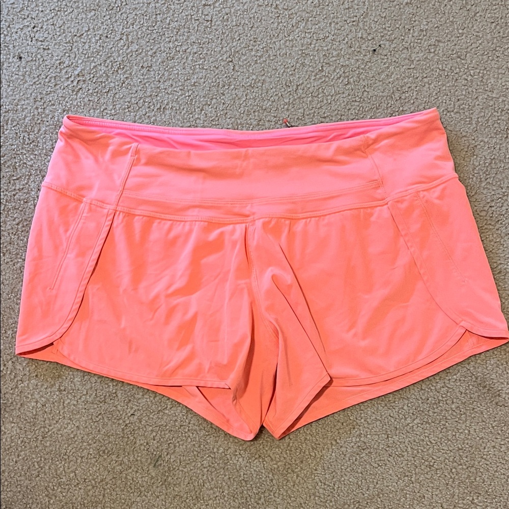 Lululemon classic 4” 4-way stretch Speed Short color is coral.